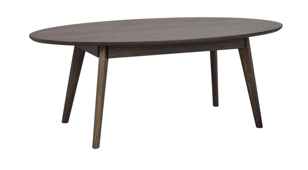 Ovalt matbord i mörkbrun ek med sneda ben i skandinavisk design