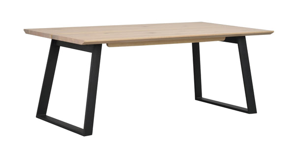 Matbord med ljus träskiva och svarta metallben i modern design