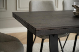 Matbord i mörkt trä med svarta ben i modern design för matsalen