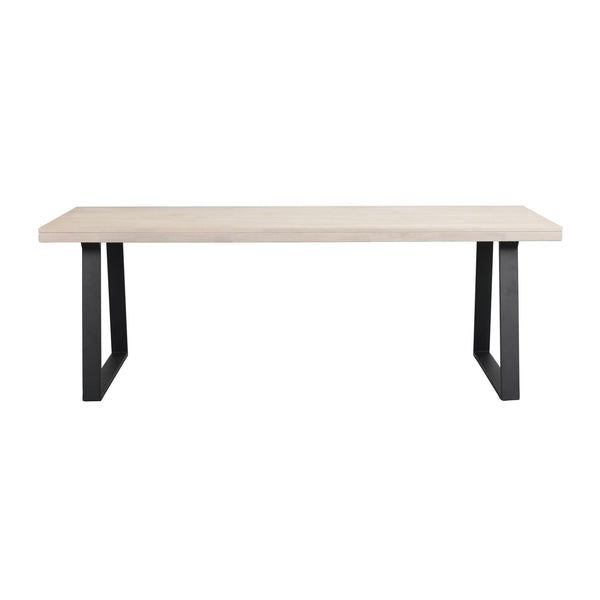 Matbord med ljus träskiva och svarta metallben i U-form, modern skandinavisk design