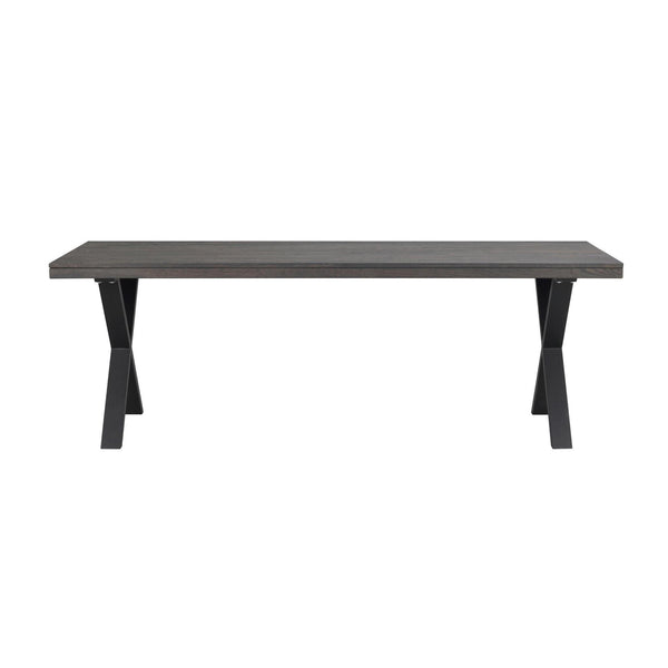 Matbord med grå träskiva och svarta korsformade metallben i modern industriell stil