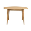 Runt matbord i ljust trä med fyra vinklade ben och enkel skandinavisk design