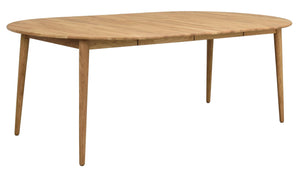 Ovalt matbord i ljust trä med fyra ben i skandinavisk design