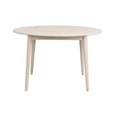 Runt matbord i ljust trä med fyra ben i skandinavisk design