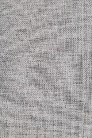 Grovvävd textil i ljusgrå och beige toner med naturlig linnestruktur