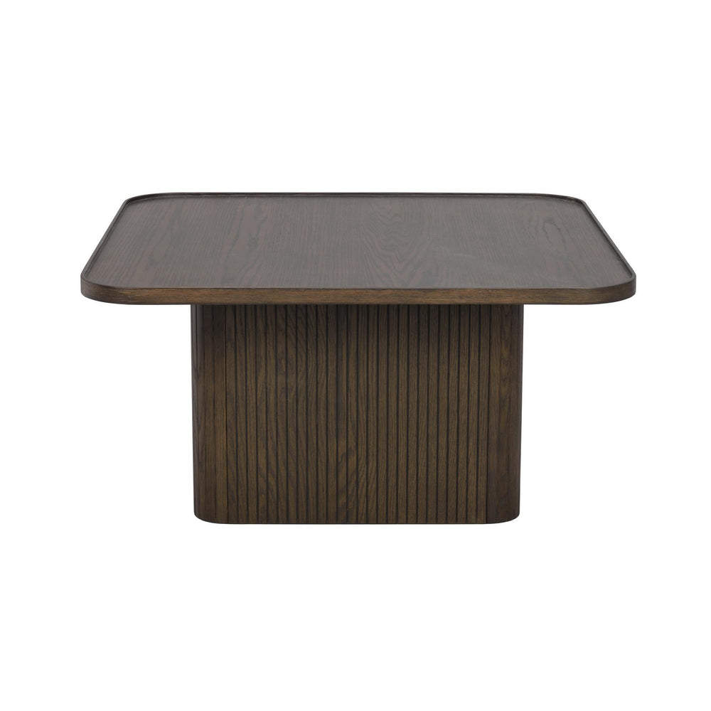 Soffbord i mörkt trä med rundade hörn och räfflad piedestalbas i modern skandinavisk design