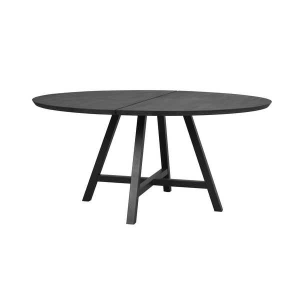 Runt matbord i svart trä med avtagbar mittdel och fyra snedställda ben i modern design