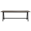 Matbord med brun träskiva och svart metallställning i industriell design