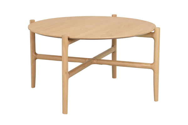 Runt soffbord i ljust trä med elegant korsformad underrede och fyra ben
