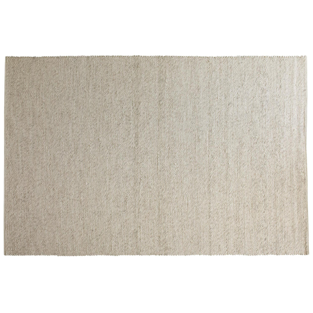 Beige handvävd jutematta med naturlig struktur och diagonala vävmönster