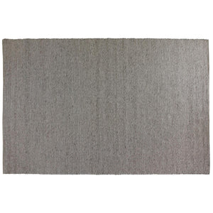 Grå handvävd jutematta med vertikal ribbad struktur och fransar längs kanterna