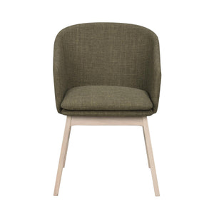 Grön stoppad stol med ljusa träben, modern design med rundad rygg och sits