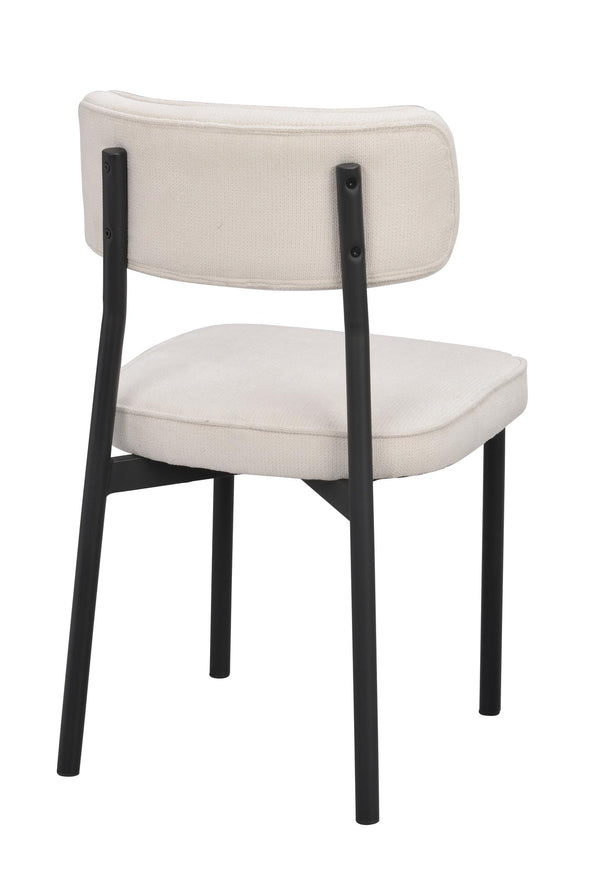 Matstol med cremevit klädsel och svart metallstativ, sedd från baksidan
