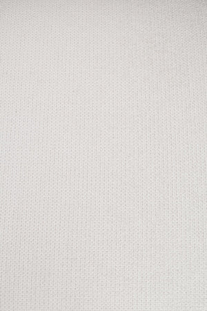 Ljusbeige väv med tät strukturerad yta, närbild av textil material för möbler eller inredning