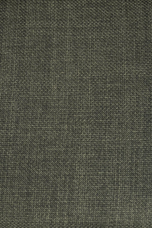 Grön melerad tygstruktur i närbilder som visar en tät vävd textil med naturlig finish