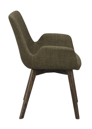 Grön stoppad stol med träben i mörk ek, visad från sidan mot vit bakgrund