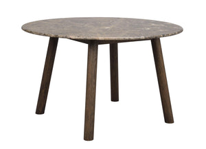 Runt soffbord med grå marmorskiva och mörka träben i modern skandinavisk design