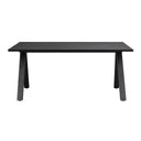 Svart matbord med raka ben i modern skandinavisk design