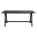 Svart matbord med raka ben och genomgående bom i modern design