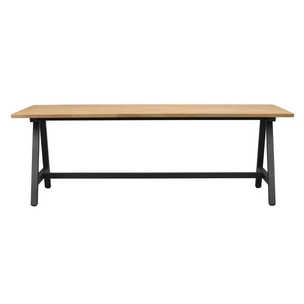 Matbord med ljus ektopp och svart metallunderrede i industriell stil