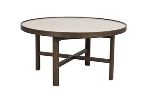 Runt soffbord i mörkbrun trä med ljus stenskiva och korslagda ben