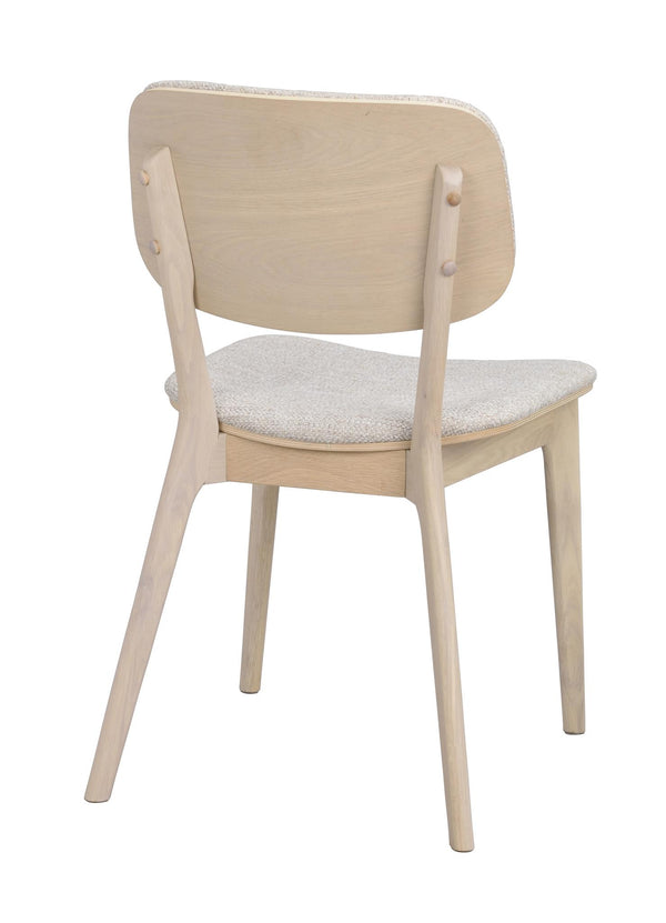 Matstol i ljust trä med stoppad sits i gråbeige tyg, sedd bakifrån