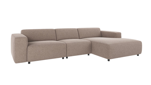 Beige modulsoffa med schäslong i bouclétyg, modern design med mjuka former