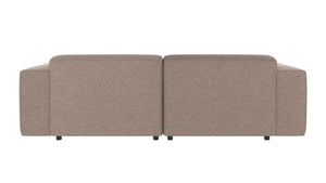 Beige tvåsits soffa sedd bakifrån med mjuka kuddar och låga ben i modern design