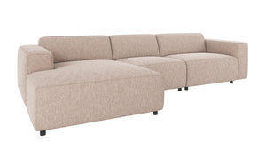 Beige modulär hörnsoffa med chaise longue i bouclé-tyg, modern design med låga ben