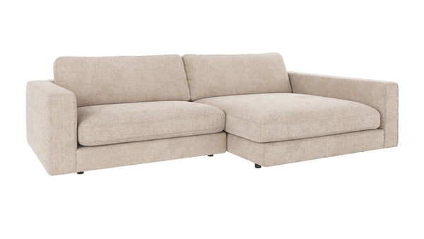 Beige modulsoffa med schäslong i ljust tyg, modern design med låga armstöd