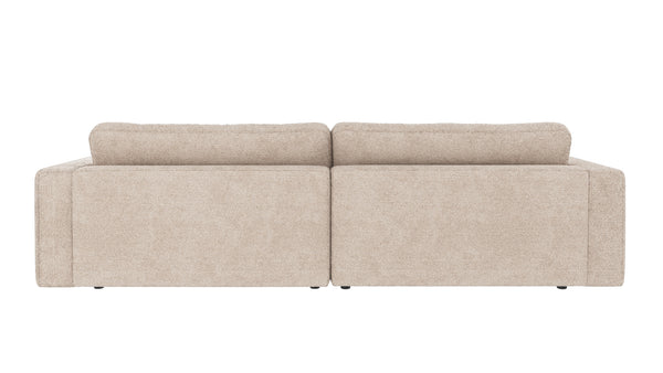 Beige tvåsits soffa med löstagbara kuddar och låg profil, sedd bakifrån