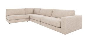 Beige hörnsoffa med armstöd i modulär design, vänsterställd med djupa sittdynor och ryggkuddar