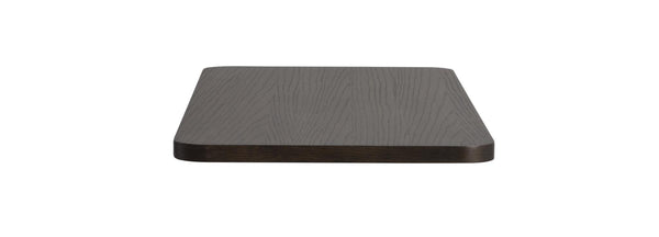 Mörkbrun rektangulär bordsskiva i trä med synlig årsringsmönster, vy från sidan