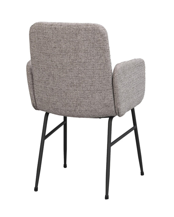 Grå stoppad stol med armstöd och svarta metallben, sedd bakifrån