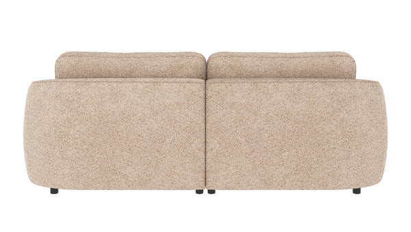 Beige tvåsitssoffa med rundade former och mjuk klädsel, sedd bakifrån