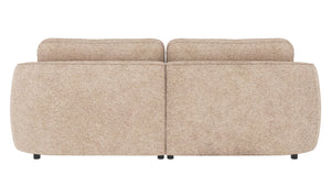 Beige tvåsitssoffa i teddy-tyg med rundade former, sedd bakifrån med två lösa ryggkuddar