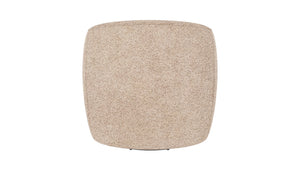 Beige sittpuff med mjuk teddy-textil och rundad fyrkantig form, sedd ovanifrån