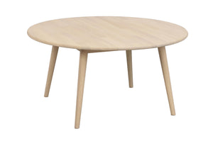 Runt soffbord i ljust trä med fyra ben i skandinavisk design