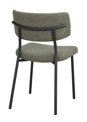 Grön stol med svart metallstativ, stoppad sits och rygg i bouclé-tyg, vy bakifrån