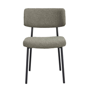 Grön stol med teddy-tyg och svarta metallben, frontvy mot vit bakgrund