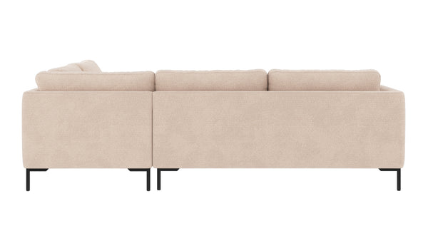 Beige L-formad soffa med chaise lounge och svarta metallben, sedd bakifrån