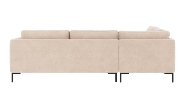 Beige soffgrupp med schäslong och svarta metallben, sedd bakifrån