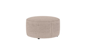 Rund beige sittpuff i teddy-tyg med låg profil och diskreta ben