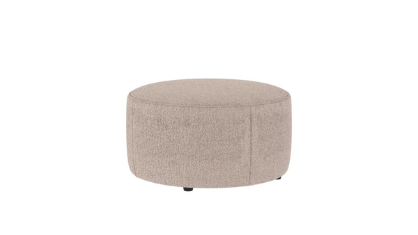 Rund beige sittpuff i teddy-tyg med låg profil och diskreta ben