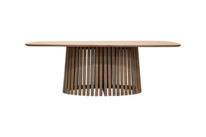 Ovalt matbord i trä med skulpturalt ribbat underrede och ljus bordsskiva