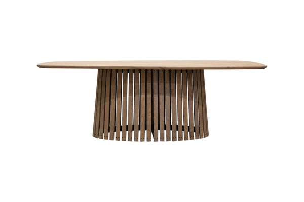 Ovalt matbord i trä med skulpturalt ribbat underrede och ljus bordsskiva